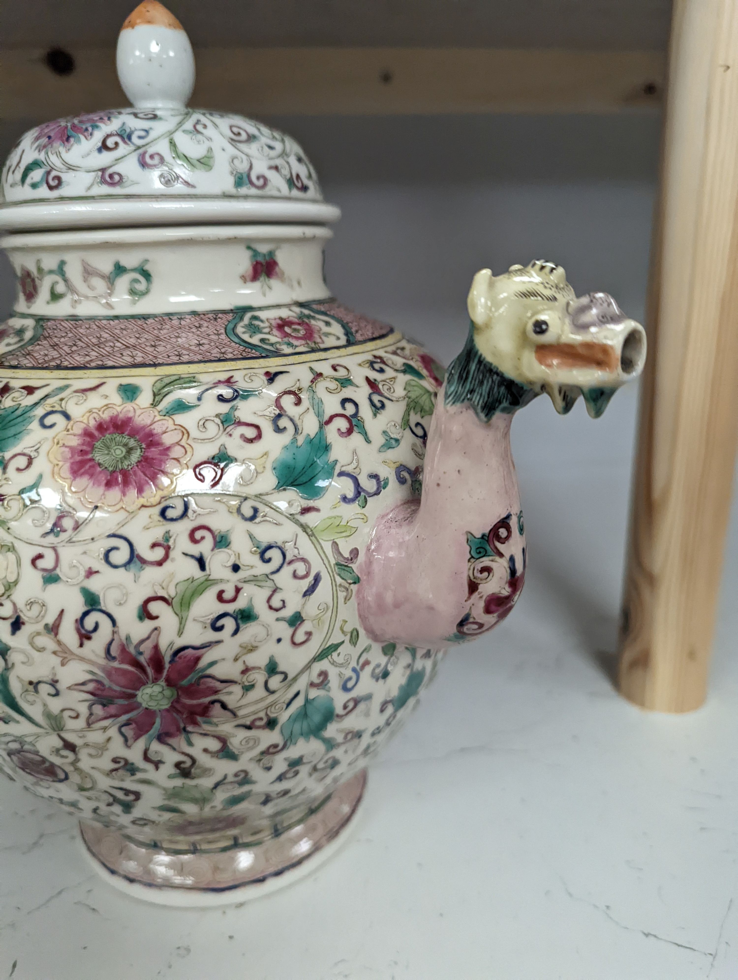 A large 19th century Chinese famille rose wine pot, and another wine pot, tallest 27cm